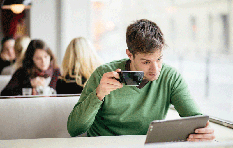 guy with tablet in restaurant